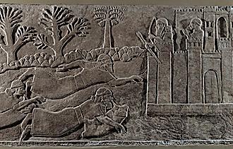 Asszír harcosok bőrtömlők segítségével kelnek át egy folyón. Részlet II. Asszurnaszirpal nimrudi reliefjéről