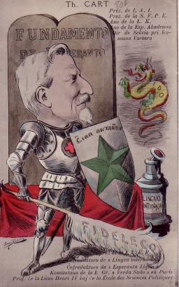 Karikatúra Théophile Cartról – az eszperantó hős lovagja a hűség tollával védelmezi a nemzetközi nyelv kalamárisából felszálló ido sárkány-szellem ellen az eszperantó alapjainak, a Fundamentónak kőtábláit